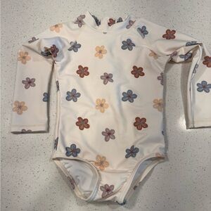 Rylee + cru Delphine rash guard one piece in Leilani print